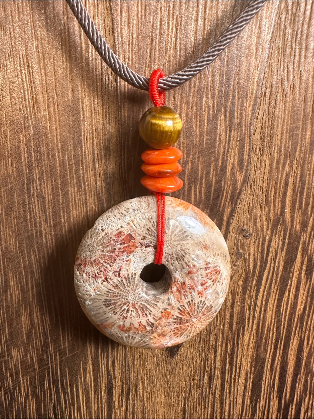 Handcrafted Red and Brown Coral Fossil Donut Pendant Necklace on Brown Rope - Picture 9 of 16
